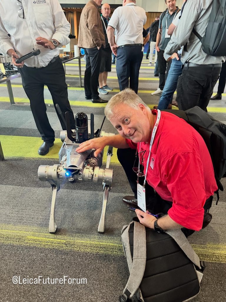 Shane Rolton of Wysiygw 3D, 3D Laser Scanning Specialists, pictured with a robotic dog that completes on-site 3D-scanning at the Leica Future Forum 2026 in Brisbane.